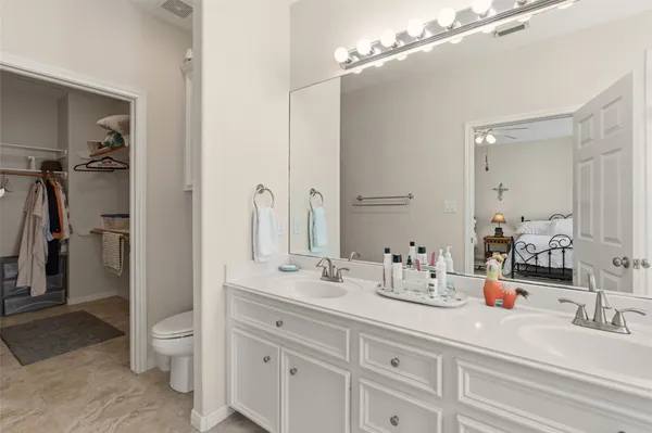 a bathroom with a shower sink and mirror
