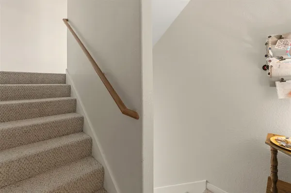 a bed room with a bed and chair