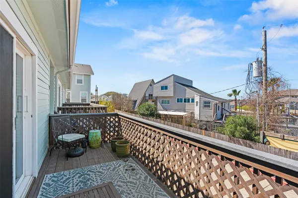 a view of balcony with furniture