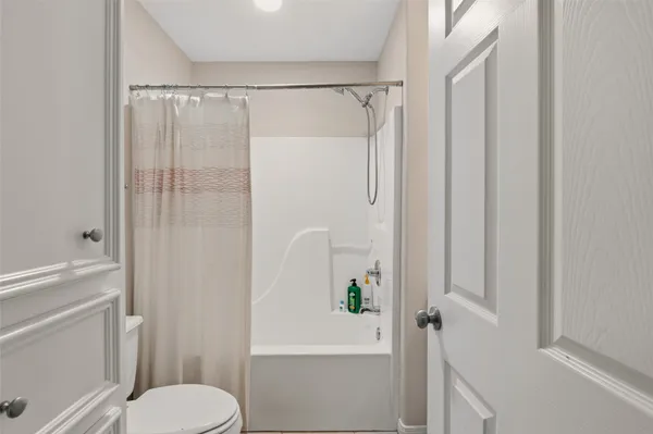 a bedroom with a bed and a table