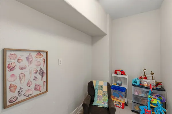 a view of city from a balcony with outdoor seating