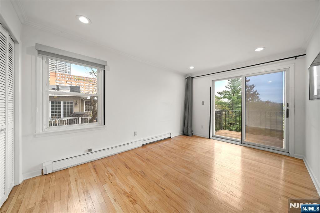 31 Hooks Lane Edgewater, NJ 07020 - Photo 18 of 31 a view of an empty room with wooden floor and a window