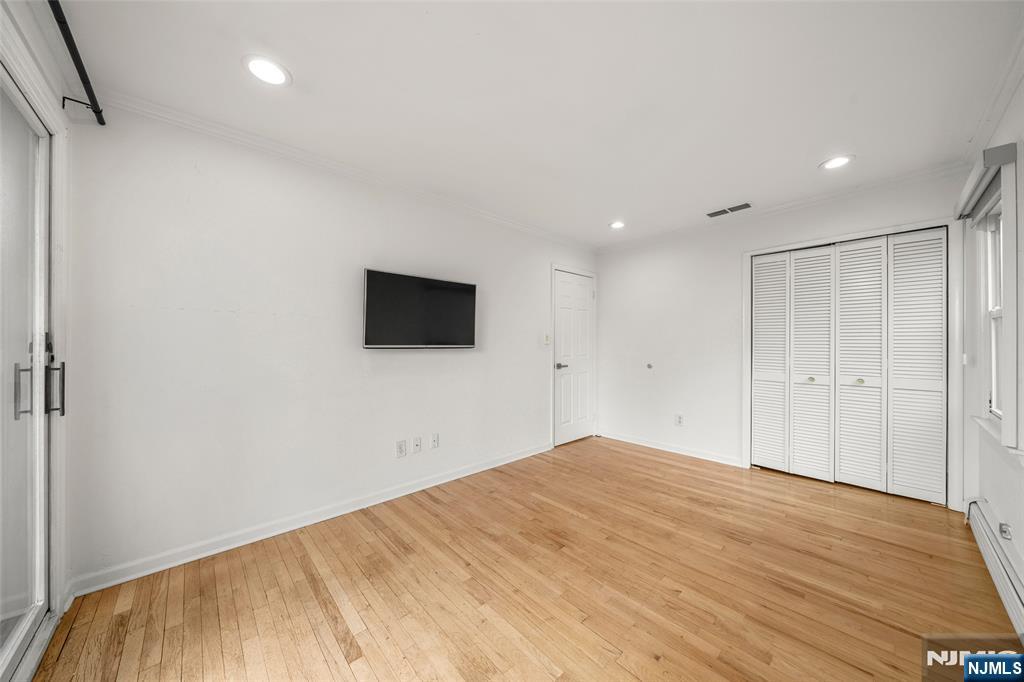 31 Hooks Lane Edgewater, NJ 07020 - Photo 20 of 31 a view of empty room with wooden floor