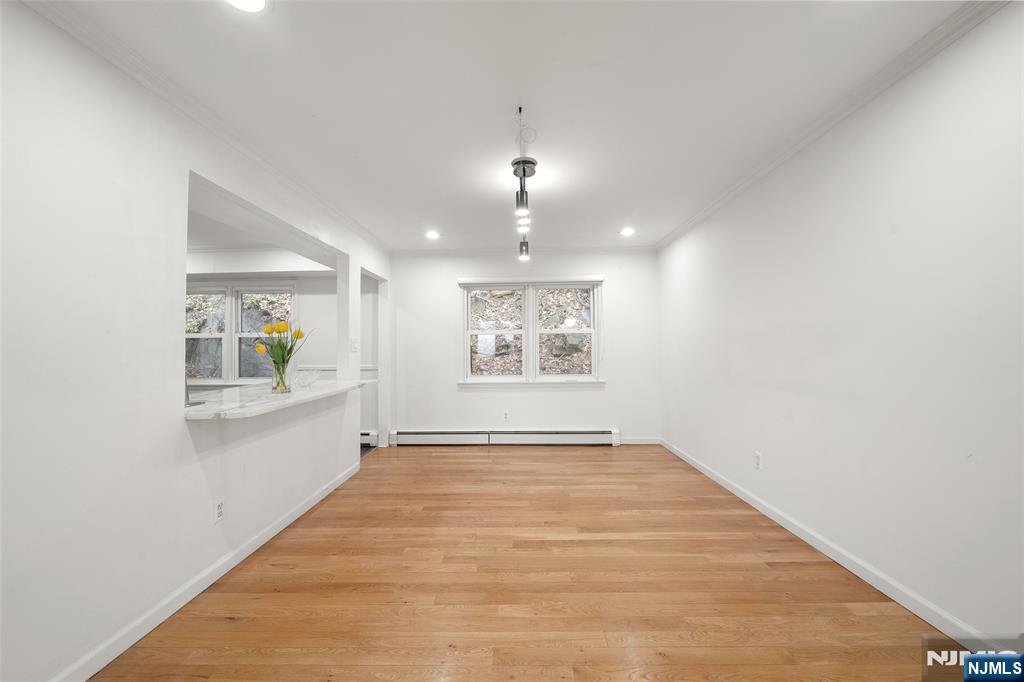 31 Hooks Lane Edgewater, NJ 07020 - Photo 9 of 31 a view of an empty room with window and wooden floor