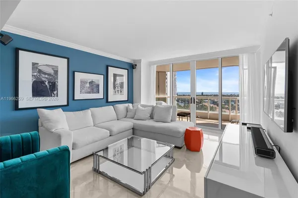 a living room with furniture and a large window