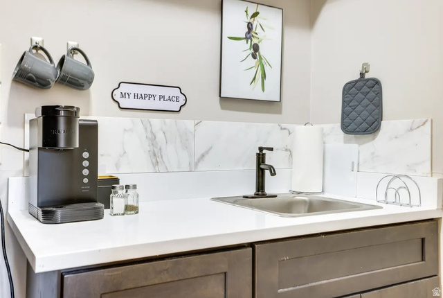 217 West Terrace Circle Toquerville, UT 84774 - Photo 17 of 25 Bar area featuring light countertops and a sink