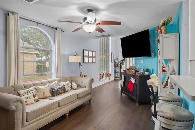 a living room with furniture and a flat screen tv
