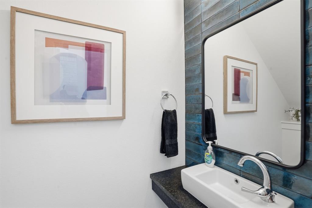 1301 Tillery Court Grapevine, TX 76051 - Photo 9 of 28 a bathroom with a sink and mirror