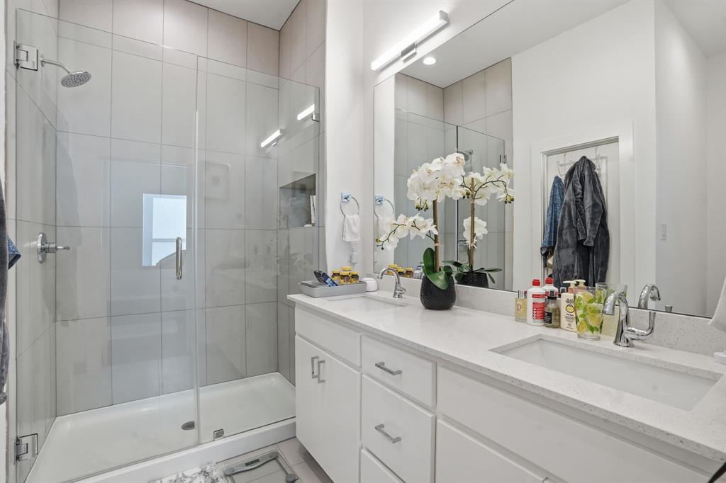 1301 Tillery Court Grapevine, TX 76051 - Photo 12 of 28 a bathroom with double vanity sink and a mirror