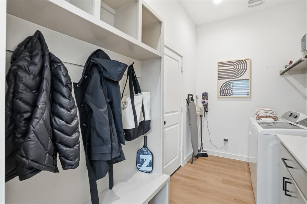 1301 Tillery Court Grapevine, TX 76051 - Photo 14 of 28 a view of walk in closet with clothes and shoes