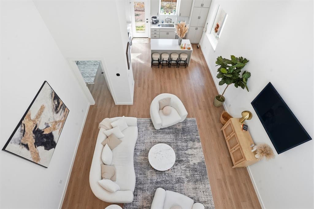 1301 Tillery Court Grapevine, TX 76051 - Photo 17 of 28 a picture of a living room with furniture and wooden floor