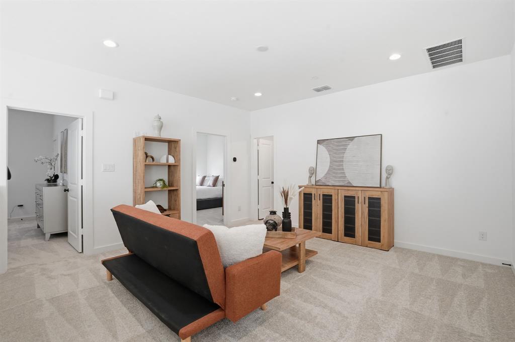 1301 Tillery Court Grapevine, TX 76051 - Photo 18 of 28 a living room with furniture a refrigerator and cabinets