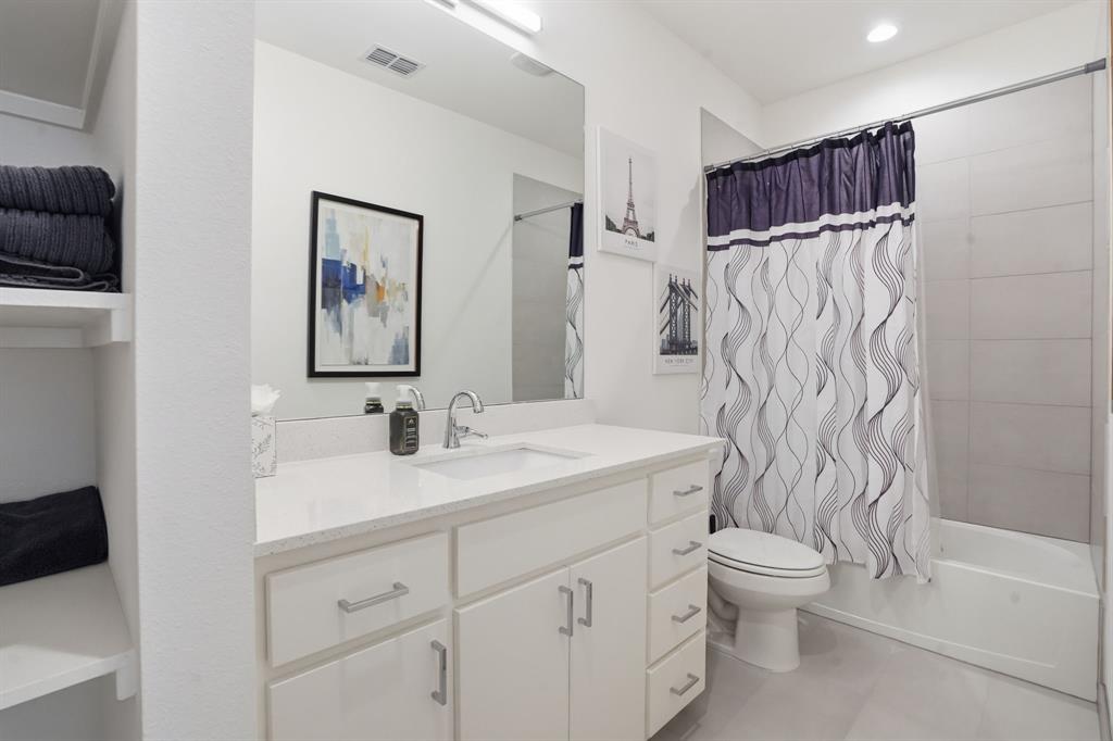 1301 Tillery Court Grapevine, TX 76051 - Photo 22 of 28 a bathroom with a sink a toilet and shower