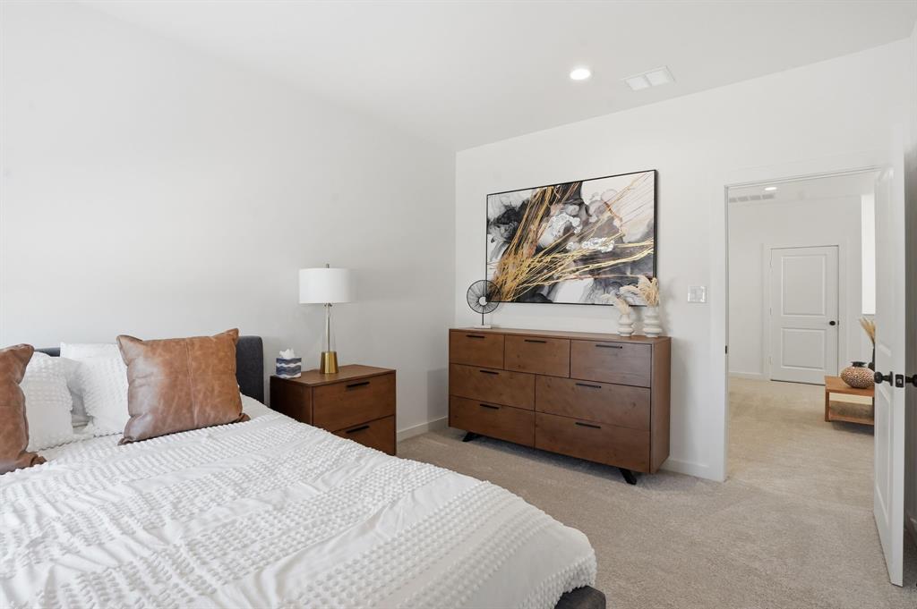 1301 Tillery Court Grapevine, TX 76051 - Photo 24 of 28 a bedroom with a bed and a couch