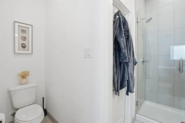 a bedroom with a bed and a lamp