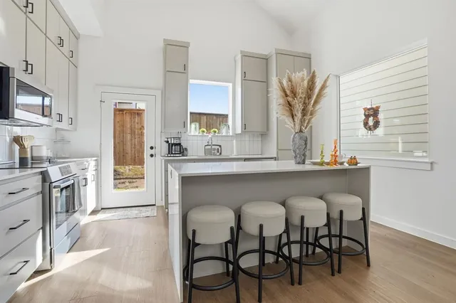 a kitchen with a sink and cabinets