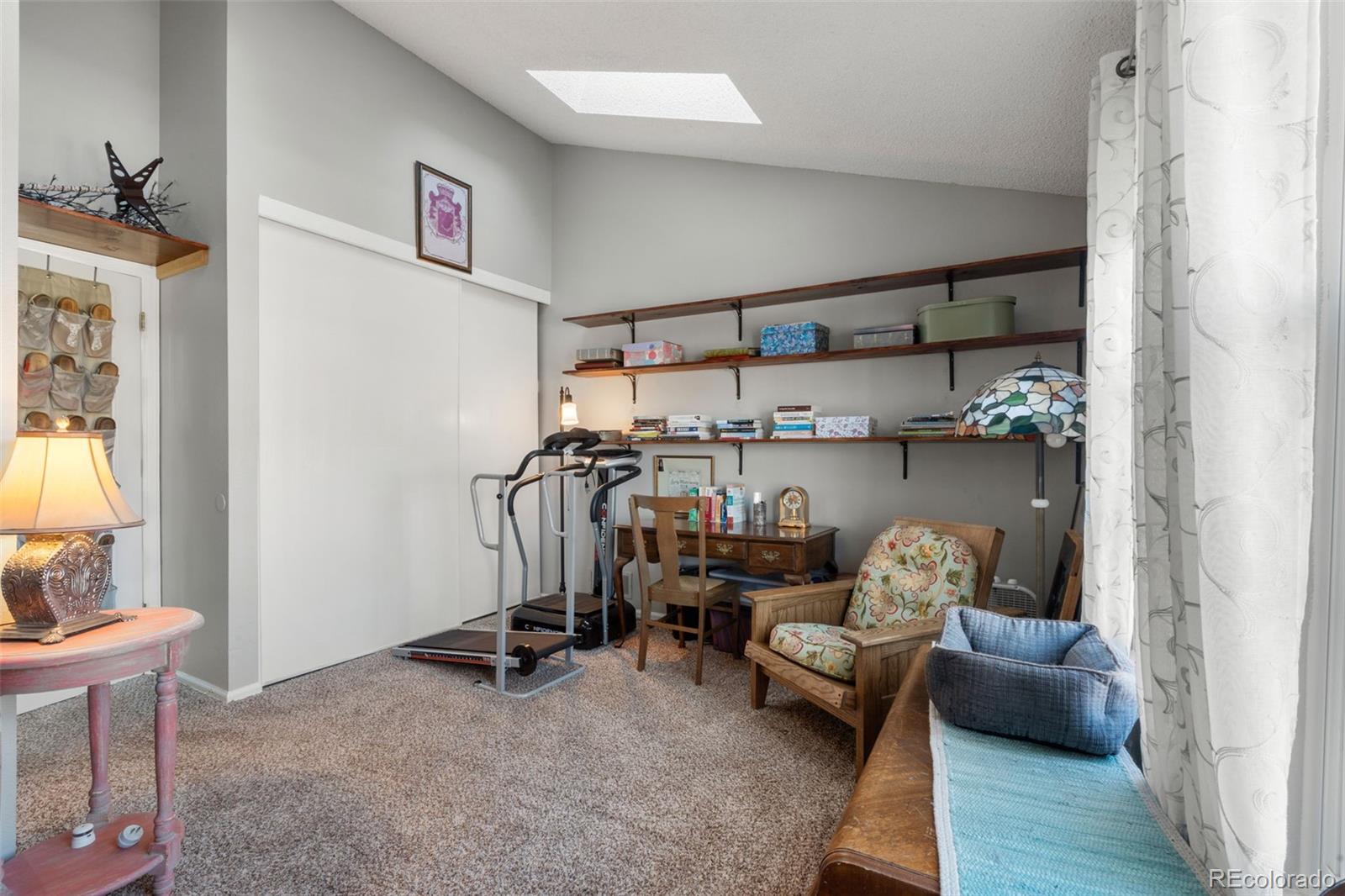 17467 East Rice Circle, Unit C Aurora, CO 80015 - Photo 14 of 25 a view of a workspace with furniture and a window