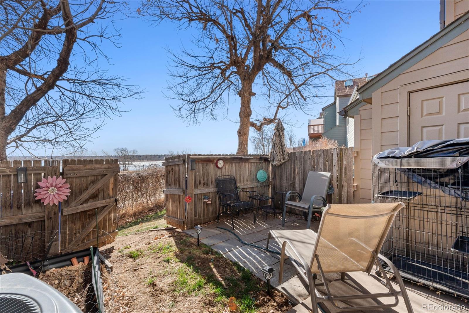 17467 East Rice Circle, Unit C Aurora, CO 80015 - Photo 22 of 25 a view of a chairs and table on the wooden floor