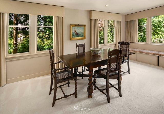 a view of a dining room with furniture window and outside view