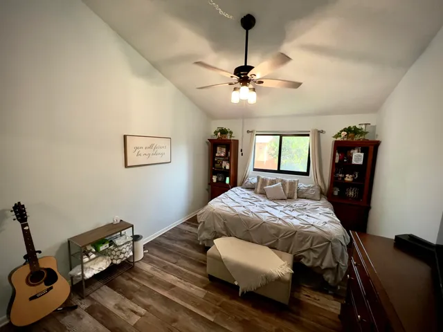 a bed room with a bed and a chandelier