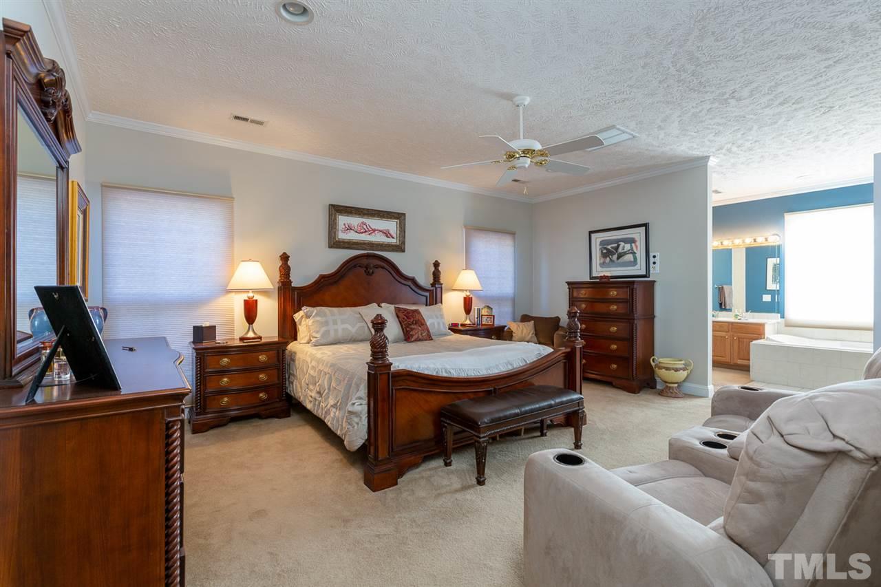 684 Alderman Mill Road Dunn, NC 28334 - Photo 14 of 30 a bed room with furniture and a flat screen tv