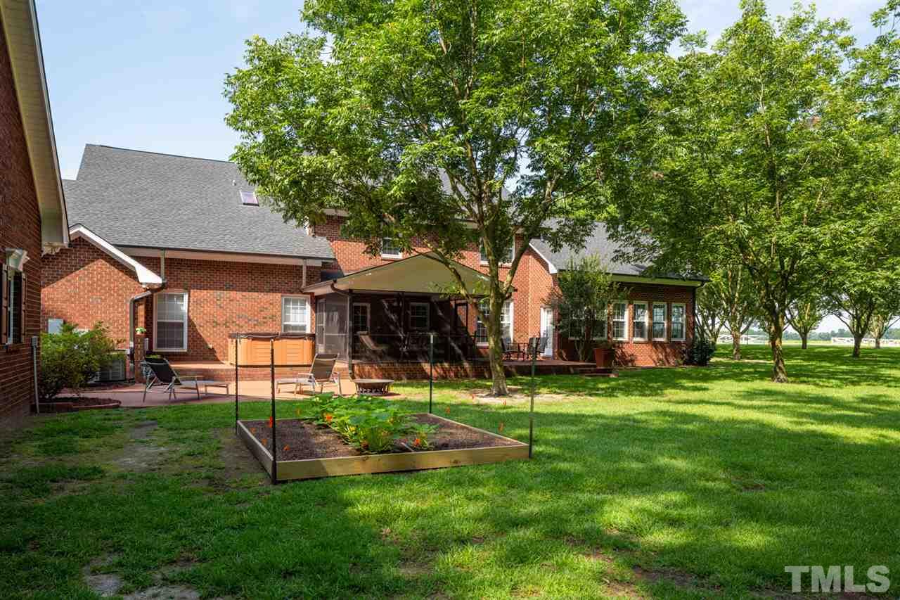 684 Alderman Mill Road Dunn, NC 28334 - Photo 3 of 30 a view of a house with a backyard