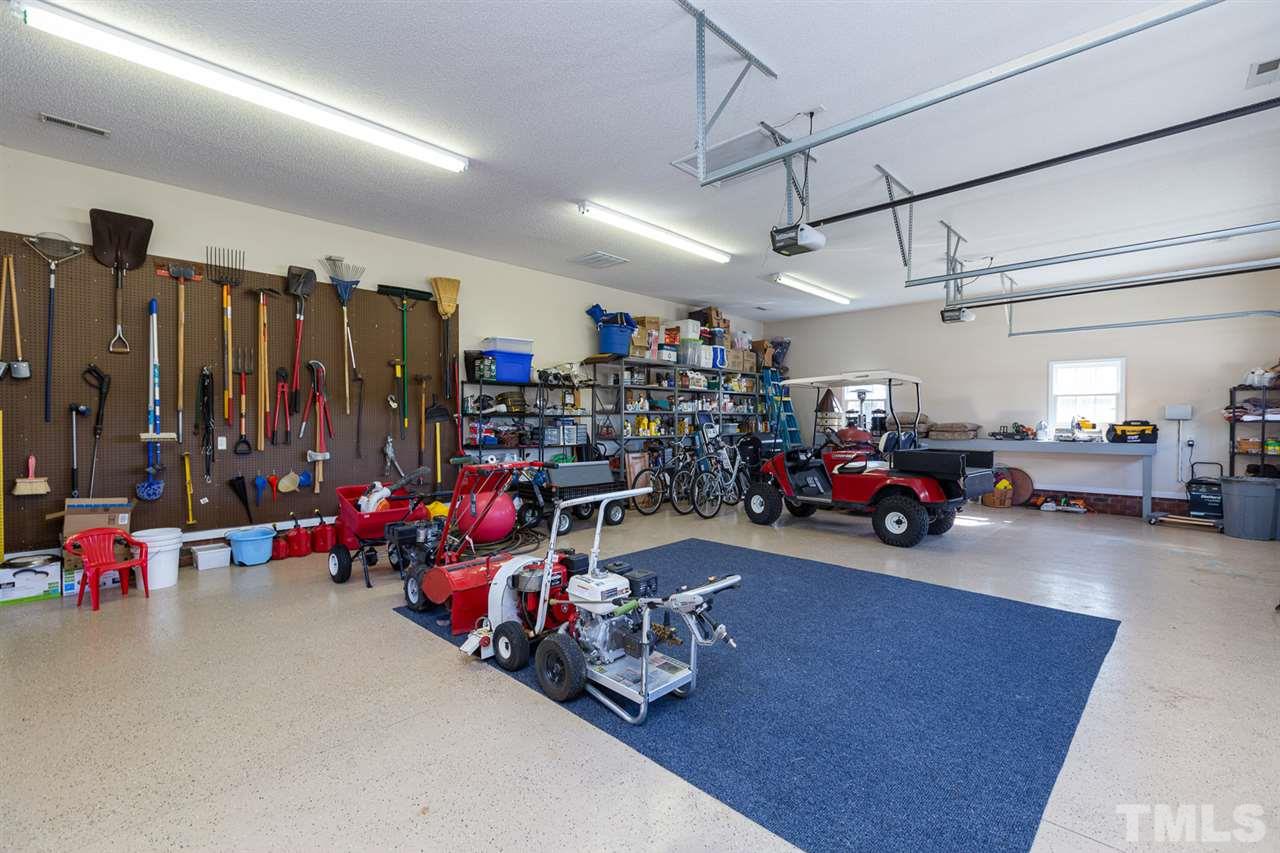 684 Alderman Mill Road Dunn, NC 28334 - Photo 22 of 30 a view of a garage with furniture and a garage