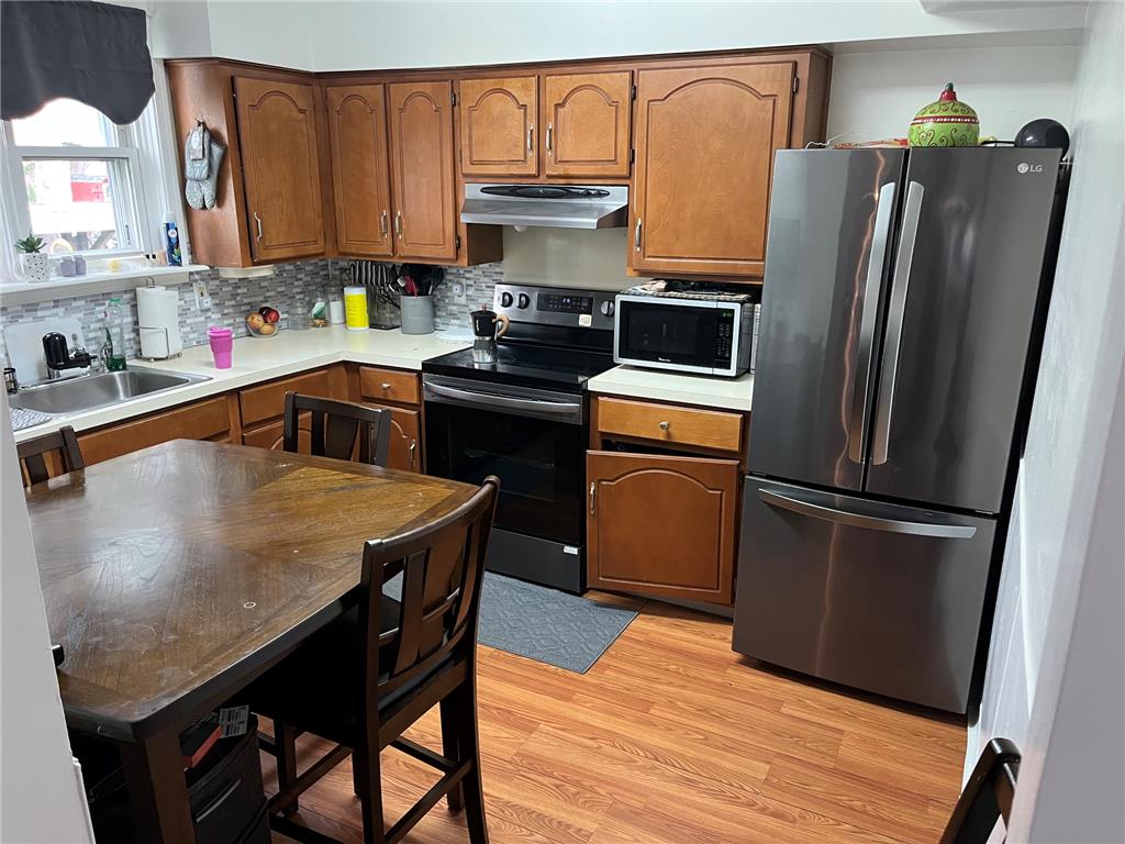 765 3rd Street Whitehall, PA 18052 - Photo 11 of 30 The well-appointed kitchen features ample cabinetry, durable countertops, and a full suite of stainless steel appliances.