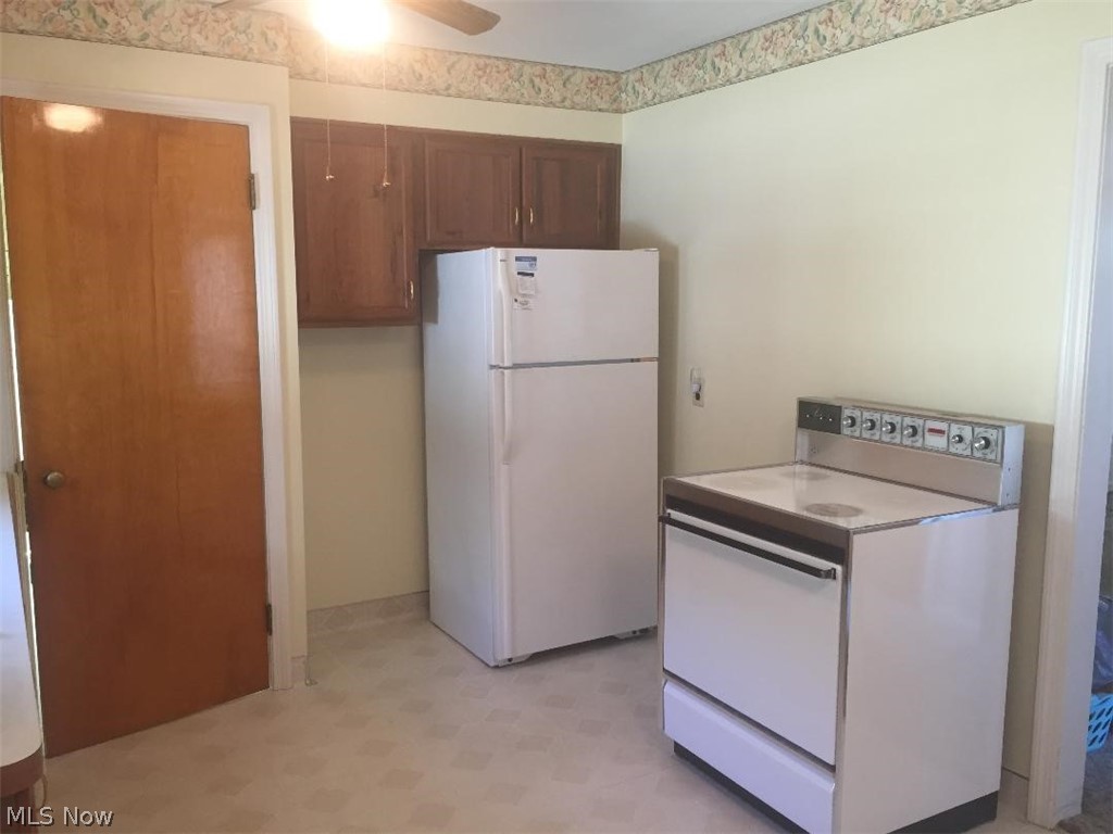13812 Granger Road Cleveland, OH 44125 - Photo 8 of 29 Another view of the kitchen showing location of refrigerator, stove and additional cabinetry. ALL appliances stay and are in good working order. For your piece of mind, the sellers are offering a FREE one-year HOME WARRANTY!