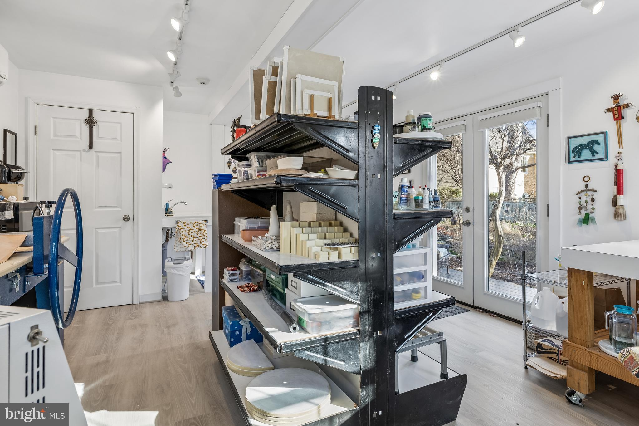 106 East Chestnut Street St. Michaels, MD 21663 - Photo 23 of 39 a bedroom with furniture and a chandelier