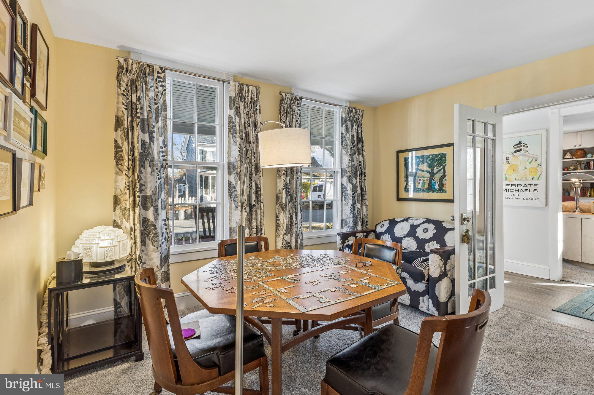 106 East Chestnut Street St. Michaels, MD 21663 - Photo 6 of 39 a view of a dining room with furniture and chandelier