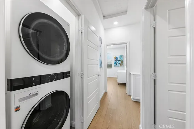 a view of a hallway with washer and dryer