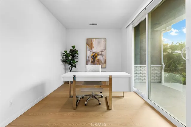 a view of a room with a table and chairs