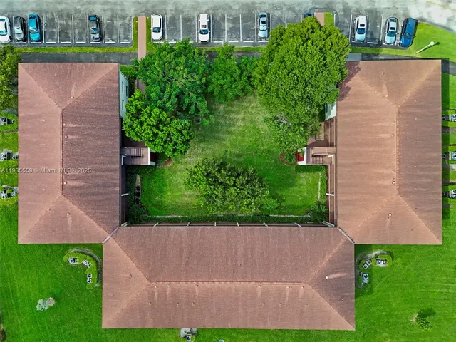 a view of a yard in front of house with a yard