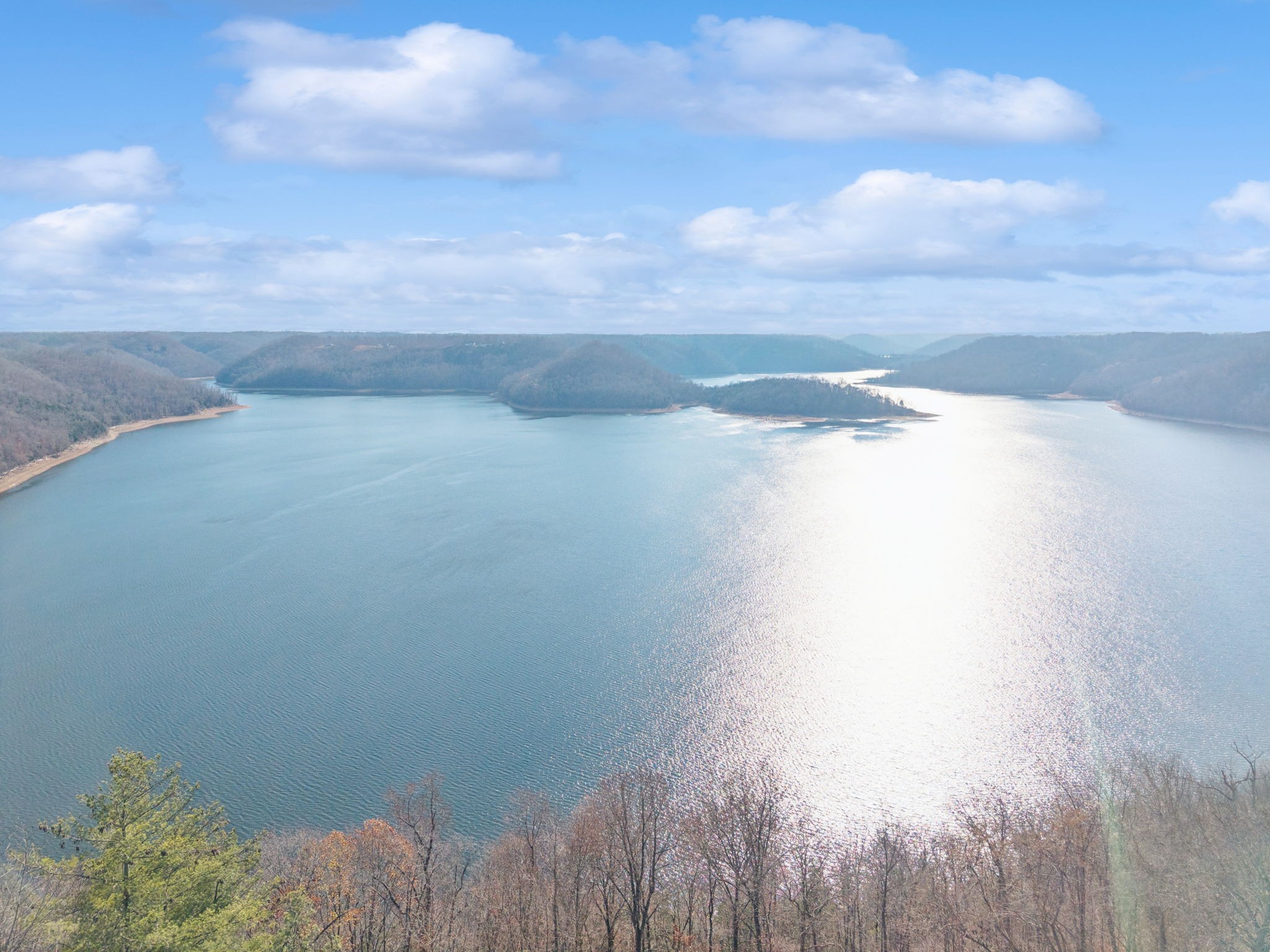 a view of a lake and mountain in the background