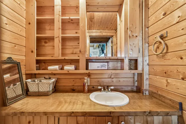 a bathroom with a sink double vanity and a mirror