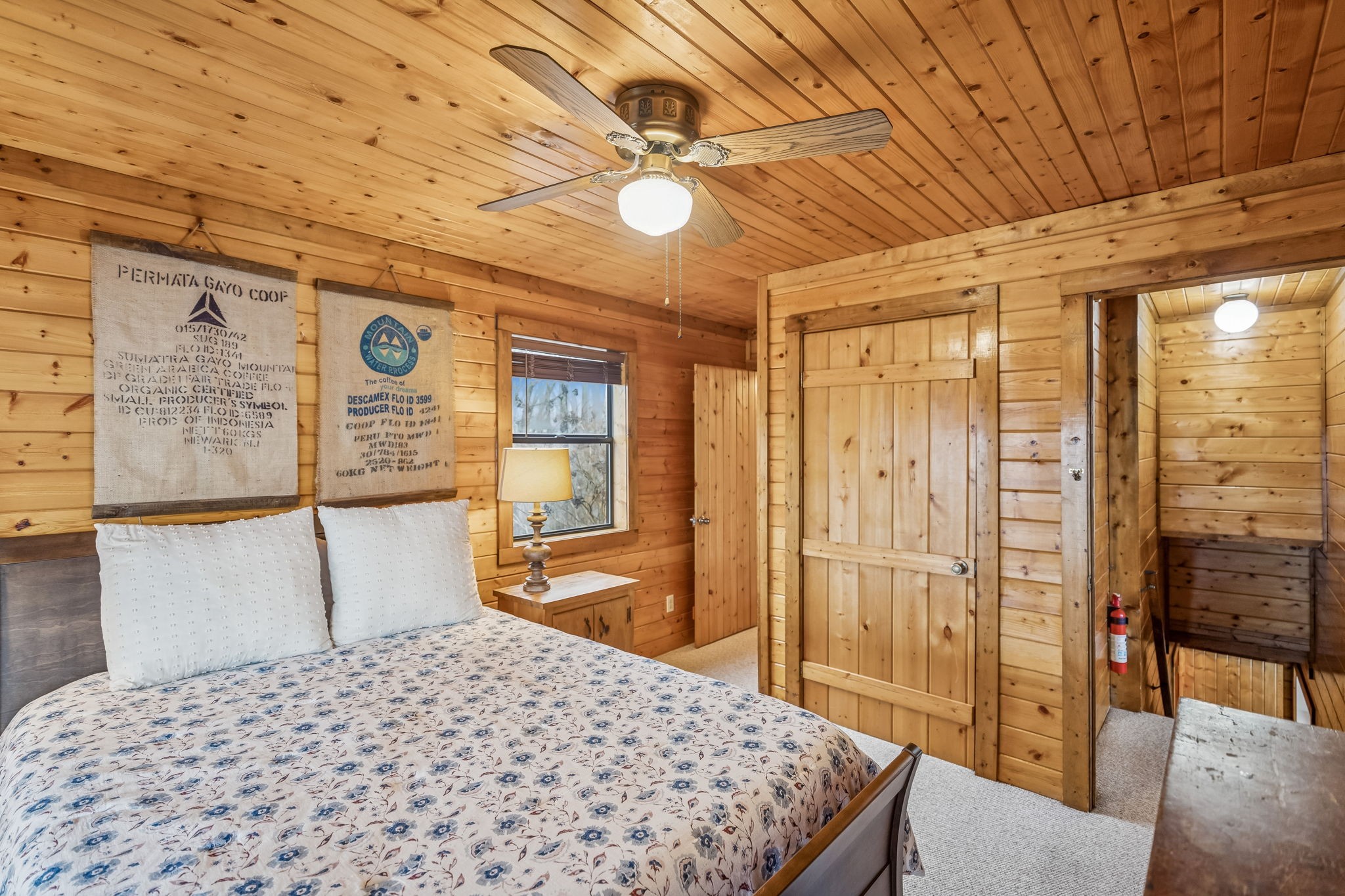 289 Dunn Ridge Road Baxter, TN 38544 - Photo 18 of 42 a bedroom with a bed and wooden floor