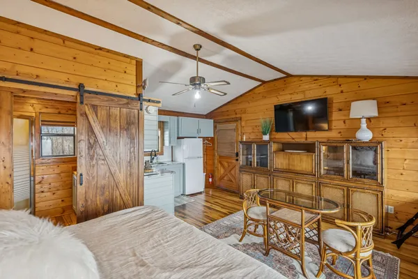 a kitchen with a refrigerator sink stove and cabinets
