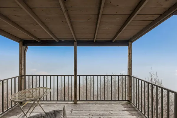 a view of a balcony with furniture