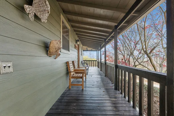 a view of balcony with furniture