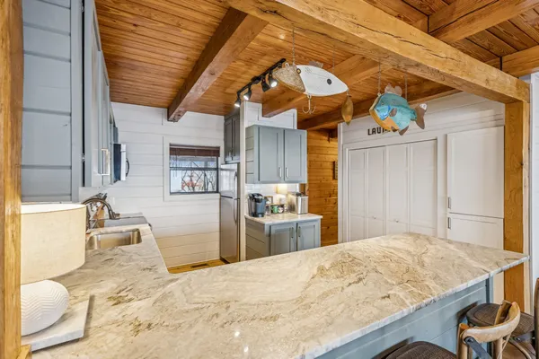 a kitchen with stainless steel appliances granite countertop a sink and cabinets
