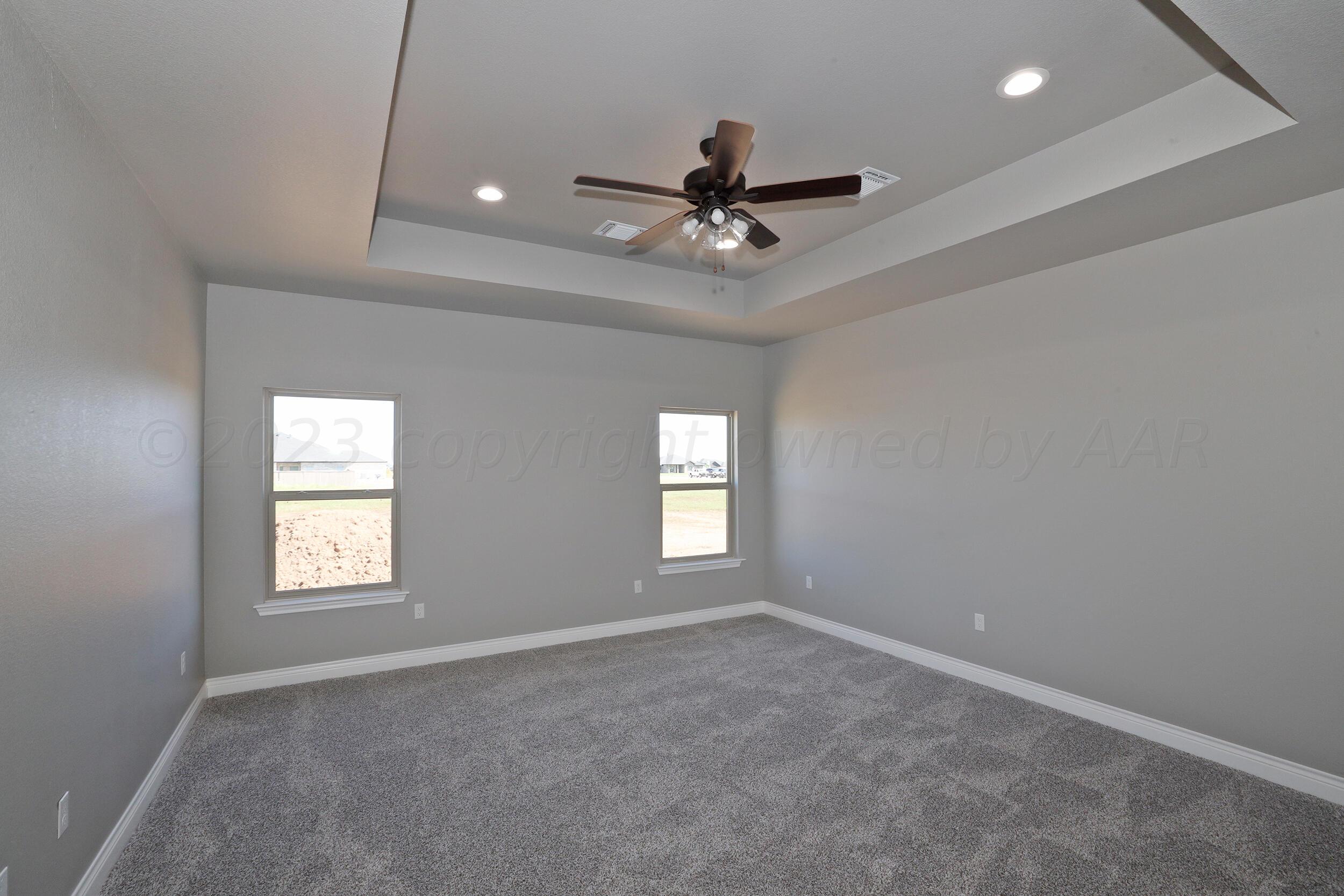 9551 Trinity Drive Amarillo, TX 79119 - Photo 19 of 46 a view of a livingroom with a ceiling fan and window