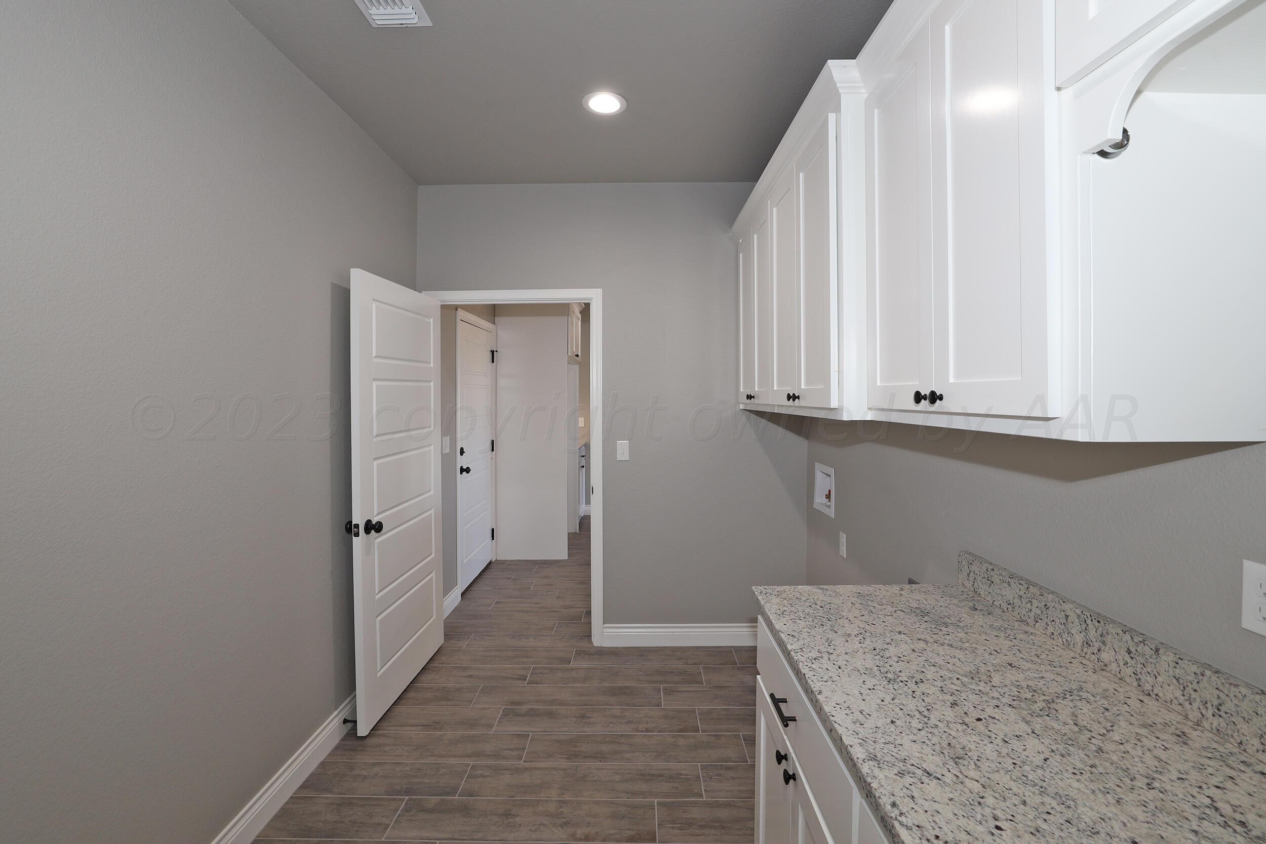 9551 Trinity Drive Amarillo, TX 79119 - Photo 25 of 46 a view of hallway with granite countertop cabinets