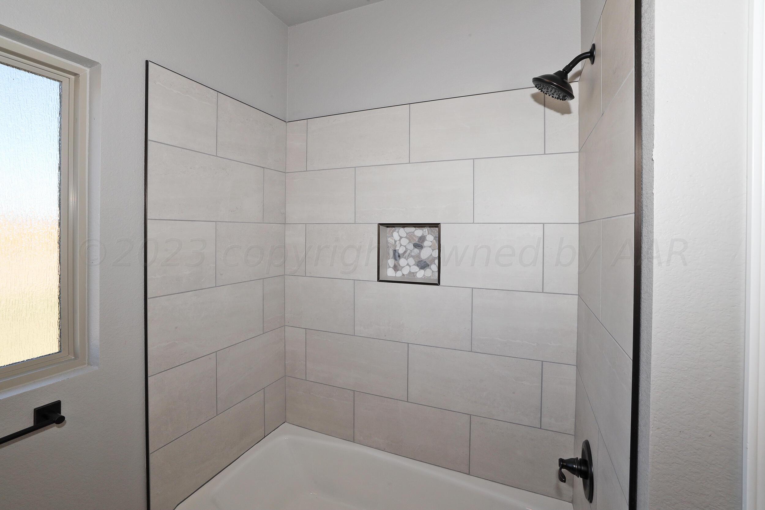 9551 Trinity Drive Amarillo, TX 79119 - Photo 26 of 46 a bathroom with a shower