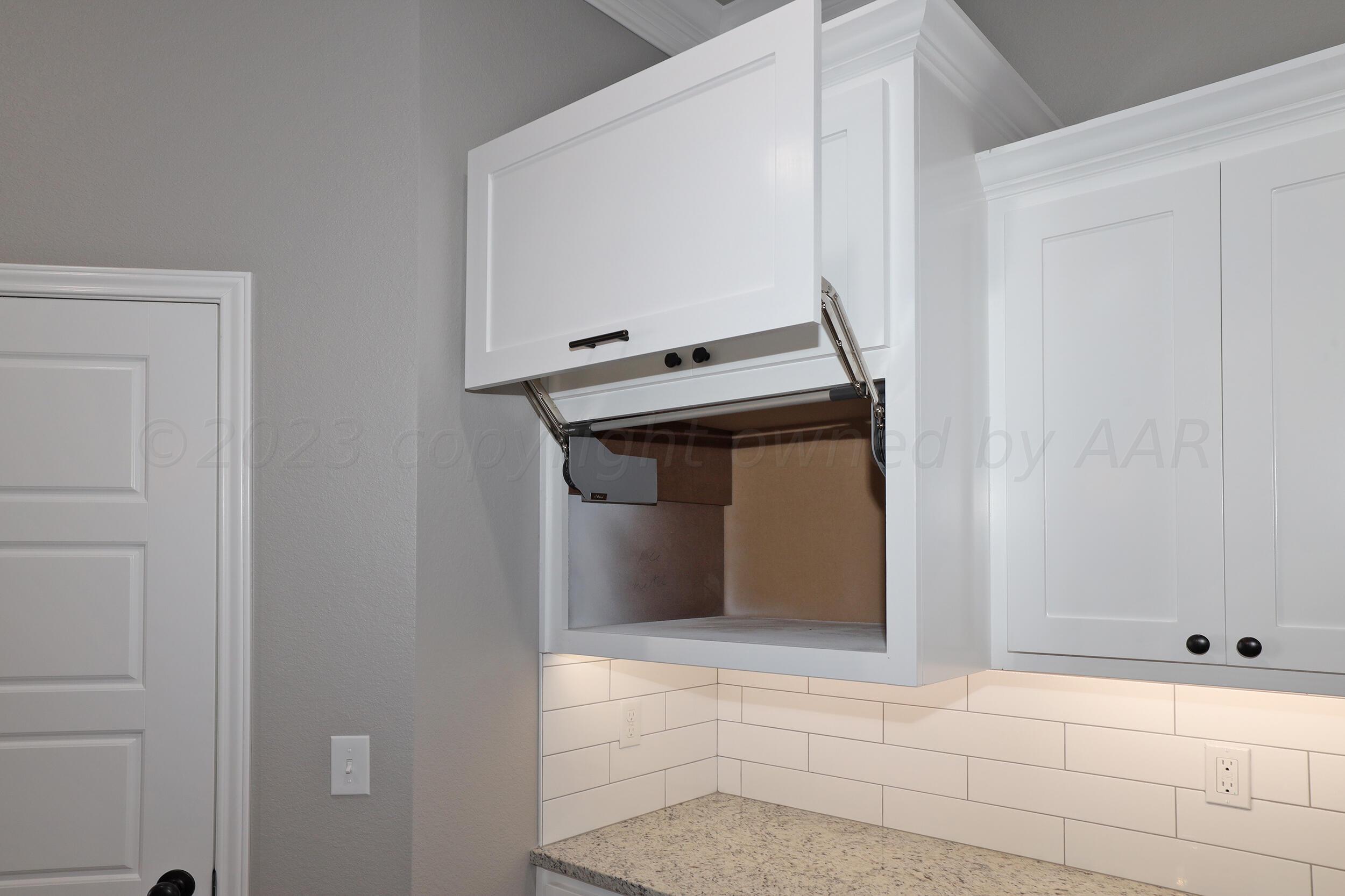 9551 Trinity Drive Amarillo, TX 79119 - Photo 35 of 46 a view of an entryway with cabinet