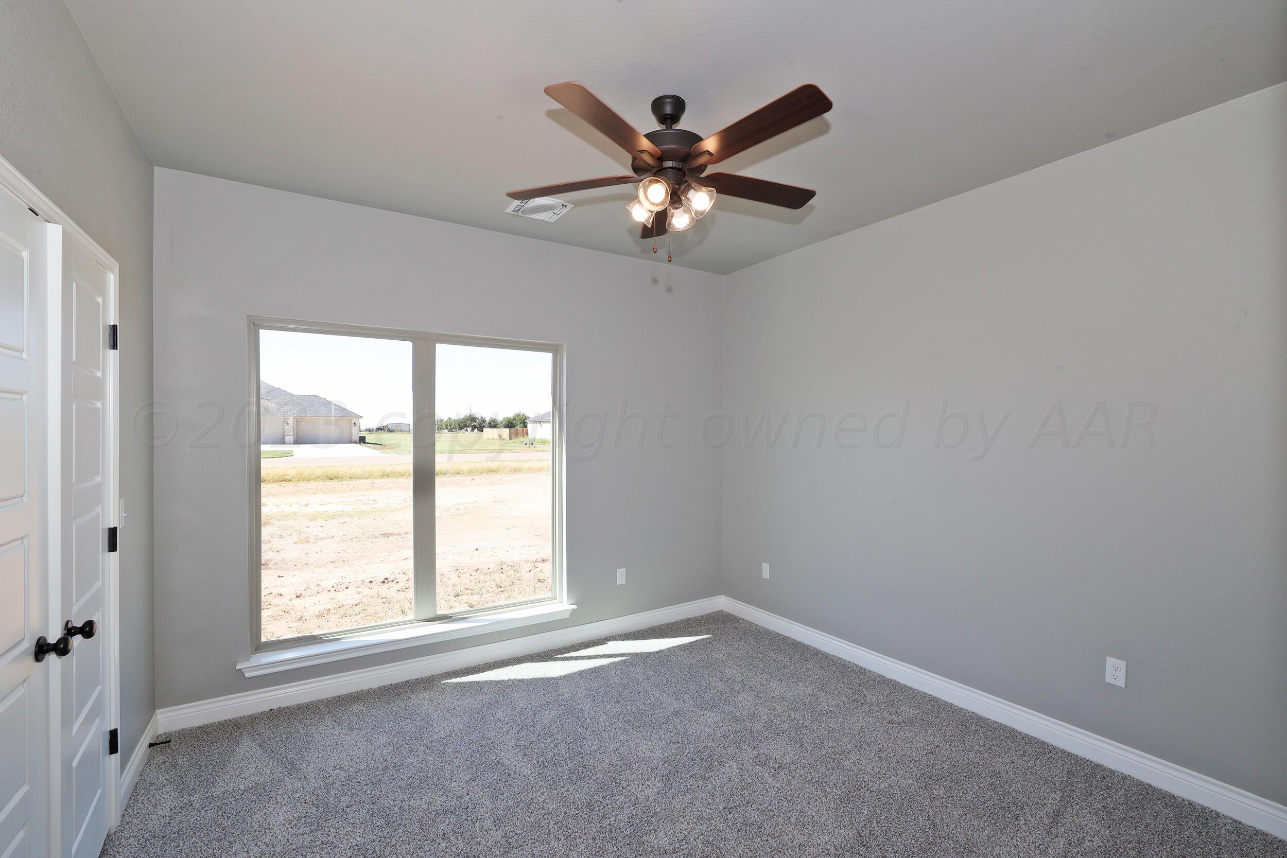 9551 Trinity Drive Amarillo, TX 79119 - Photo 42 of 46 a view of an empty room with a window