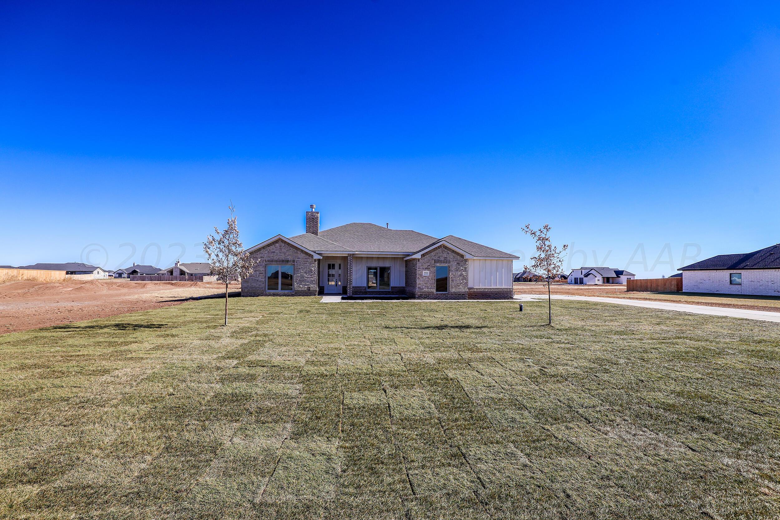 9551 Trinity Drive Amarillo, TX 79119 - Photo 45 of 46 a view of a house with a yard