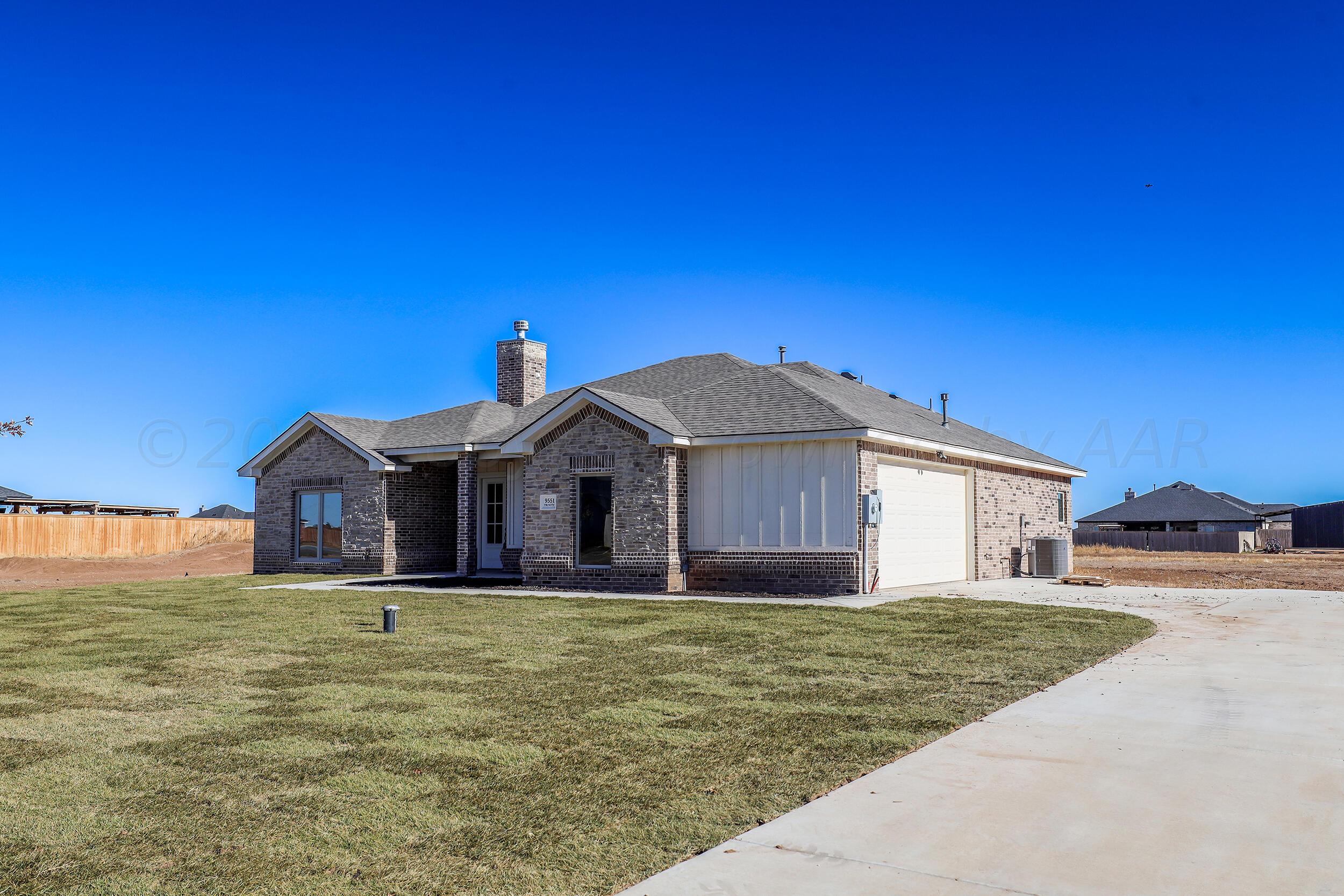 9551 Trinity Drive Amarillo, TX 79119 - Photo 46 of 46 a front view of a house with a yard
