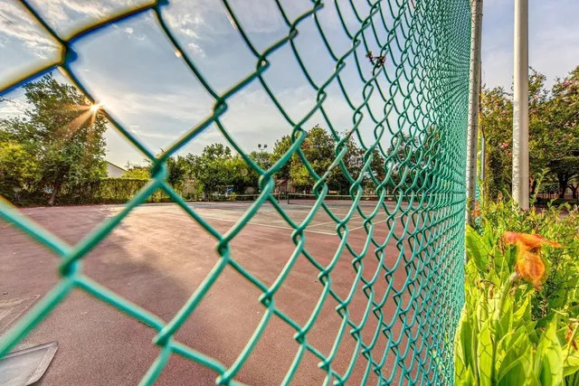 a view of a wooden deck and a yard