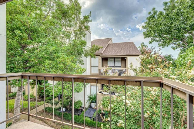 a view of a pathway of a house with a yard